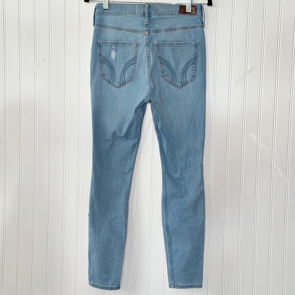 ULTRA HIGH-RISE RIPPED LIGHT WASH SUPER SKINNY JEANS. Item# 0046 - Picture 5 of 7